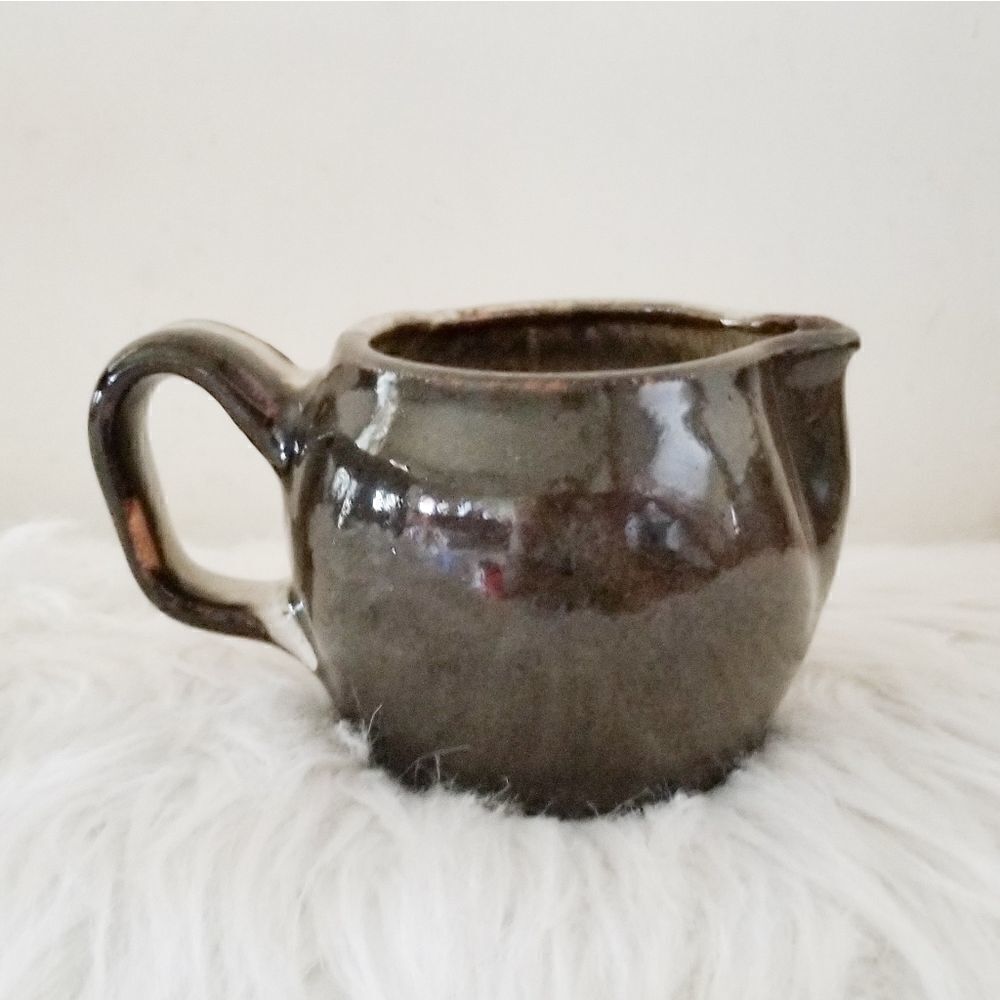 Pottery creamer multi colored